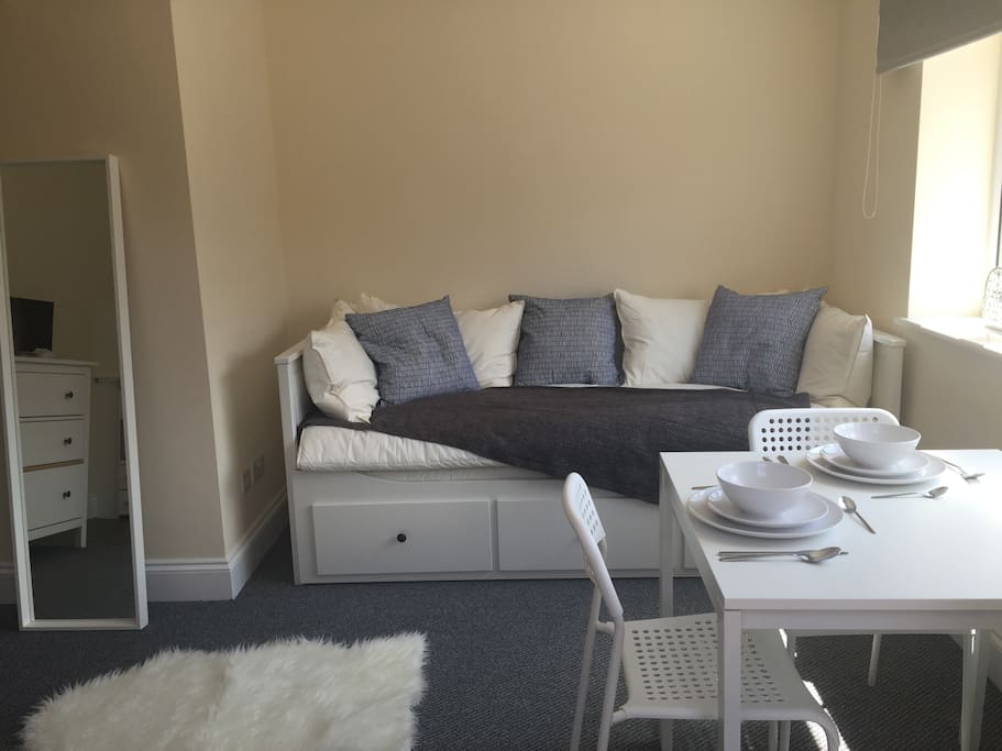 Cosy studio room with comfy single or double bed that doubles up a sofa during the day.