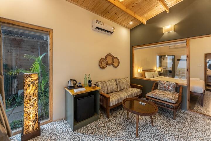 Relax in a bright & spacious living room with stunning sea views and direct beach views, creating the perfect setting to unwind after a day by the shore. Stay comfortable with AC & Smart TV, while soaking in the peaceful ambiance of Morjim Beachfront