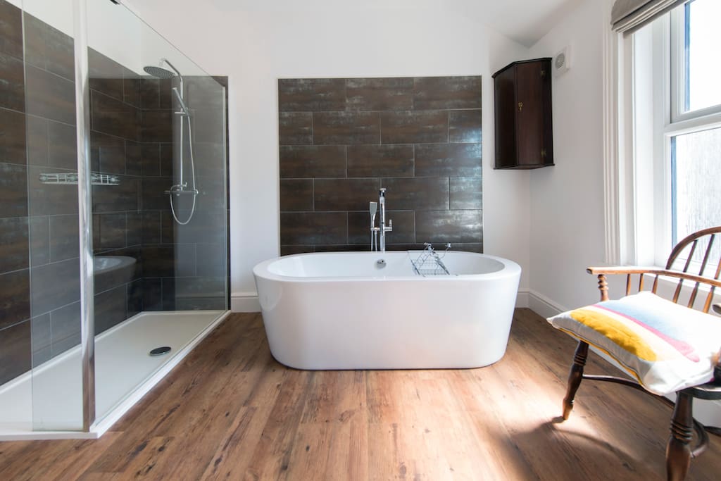 Beautifully appointed, spacious bathroom with free standing bath, double shower and two sinks.