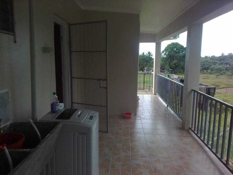 The back porch where guests can do their laundry or bring out a chair and have a hot or cold beverage and enjoy the breeze.