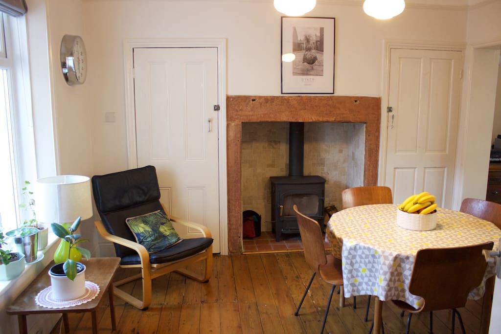 Open plan dining room with log burning stove and extendable dining table to sit up to 6 people.
