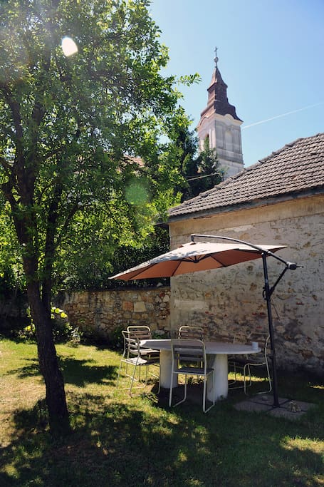 Garden table under the church tower