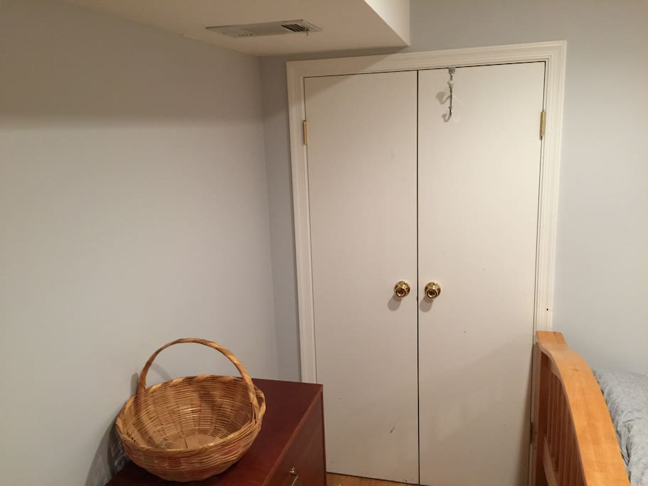 Dresser and closet in bedroom