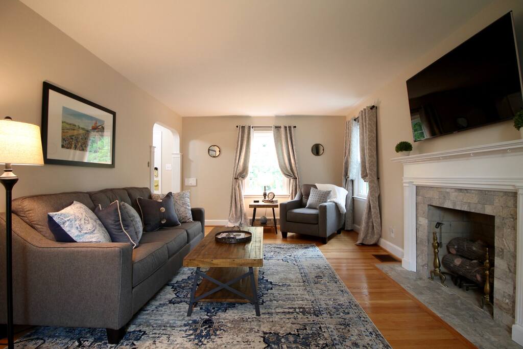 Large living room with lots of seating and a great large screen tv for viewing!