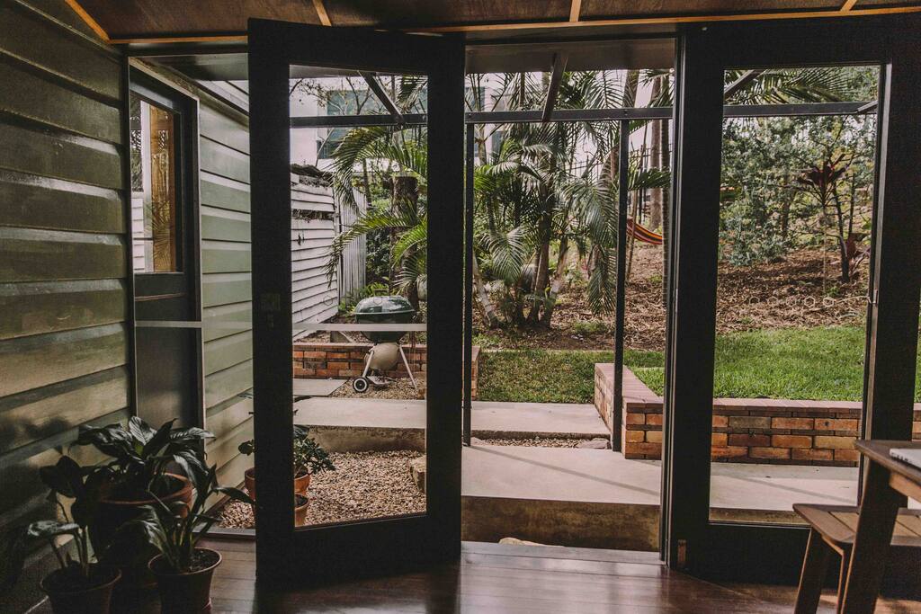 View of backyard from dining room/back deck that opens up to the backyard.