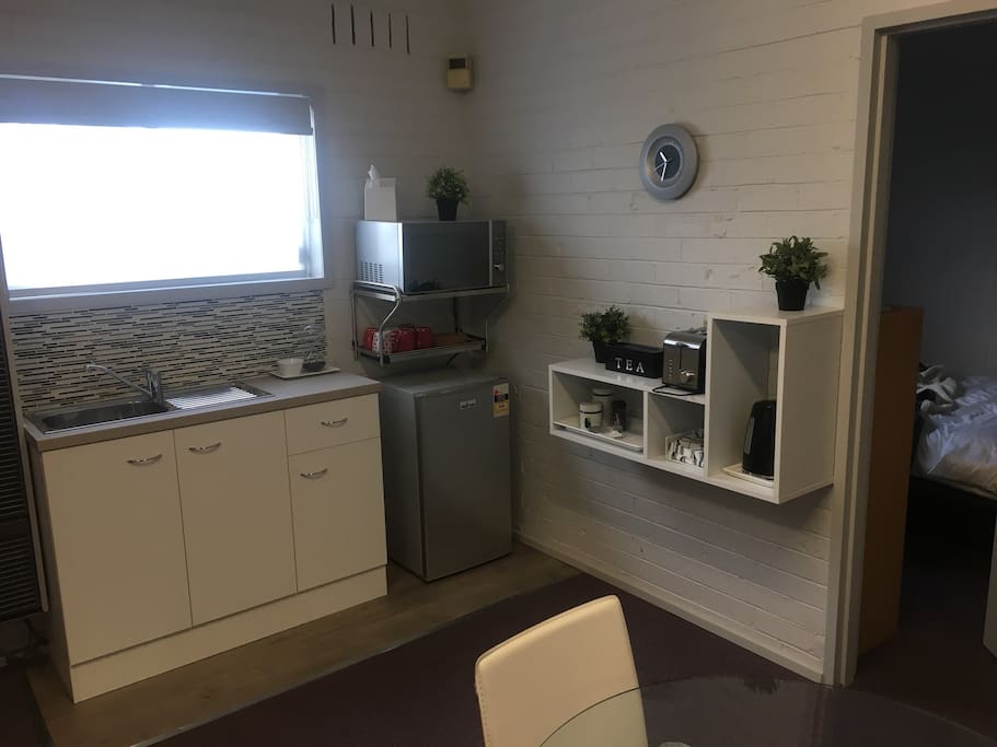 kitchenette with fridge and convection microwave