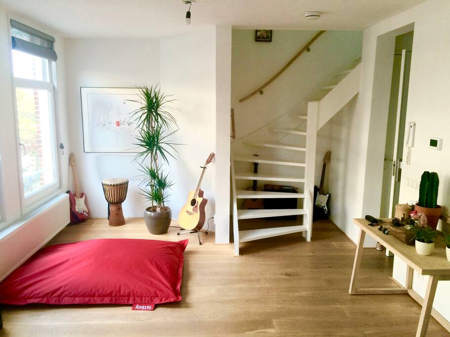 Large living area downstairs with French balconies