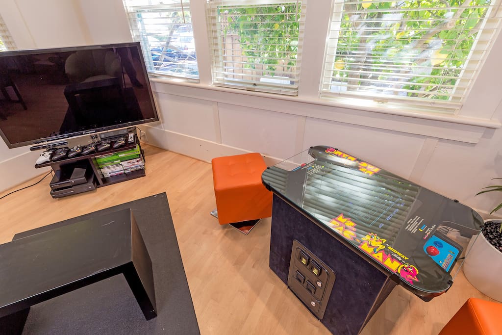 The living room includes a gamer's paradise ... with a full restored vintage gaming console with Ms Pacman