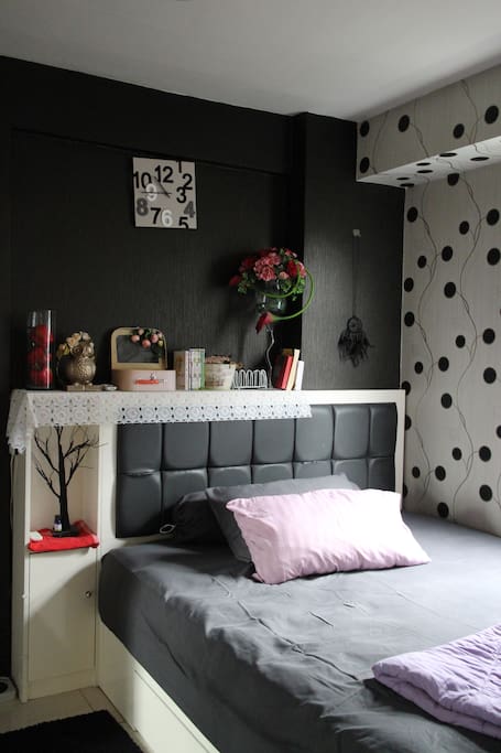 Main Bedroom with a queen Sized bed. Equipped with Air Conditioner (AC), Full body Mirror and a big Wardrobe