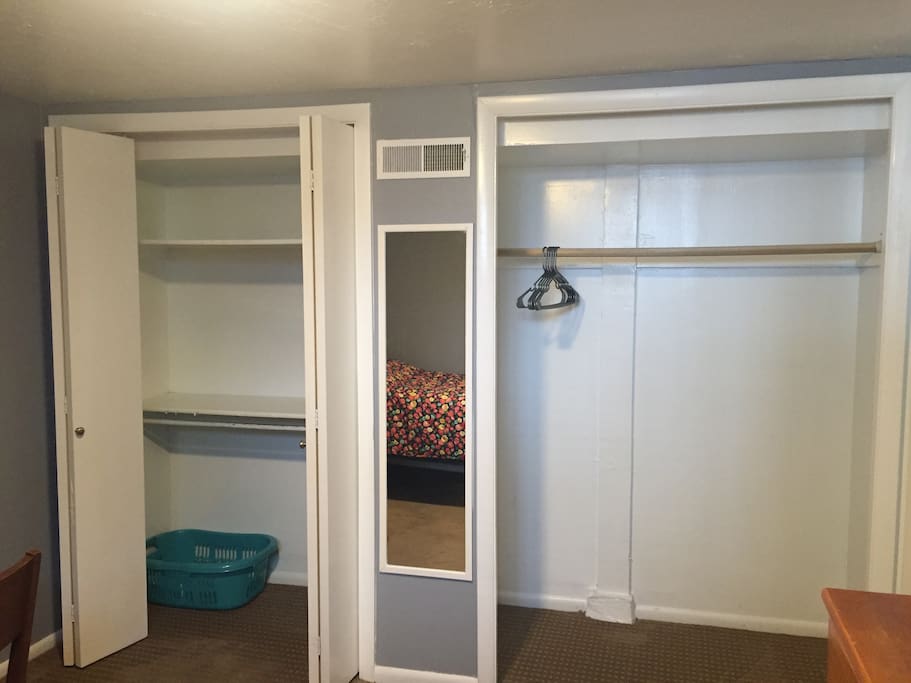 Double closet with a mirror in between. Laundry hamper/basket and a few hangers included.