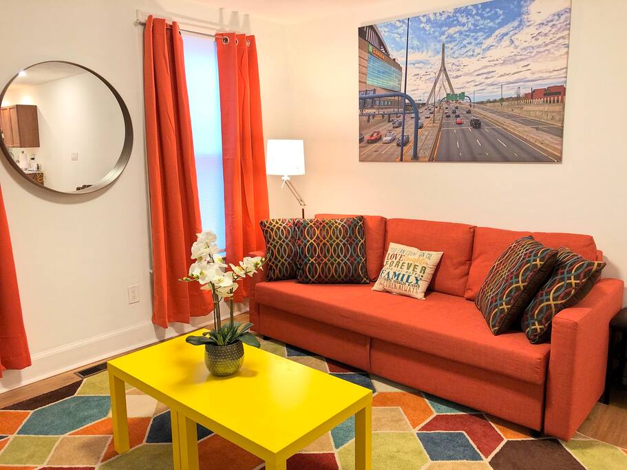 Living room with full size pull out sofa. Mac took all the photos on the various walls - they are all of various places in Boston - hope you enjoy them!