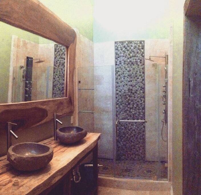 The master bath is spacious, modern, and relaxing.