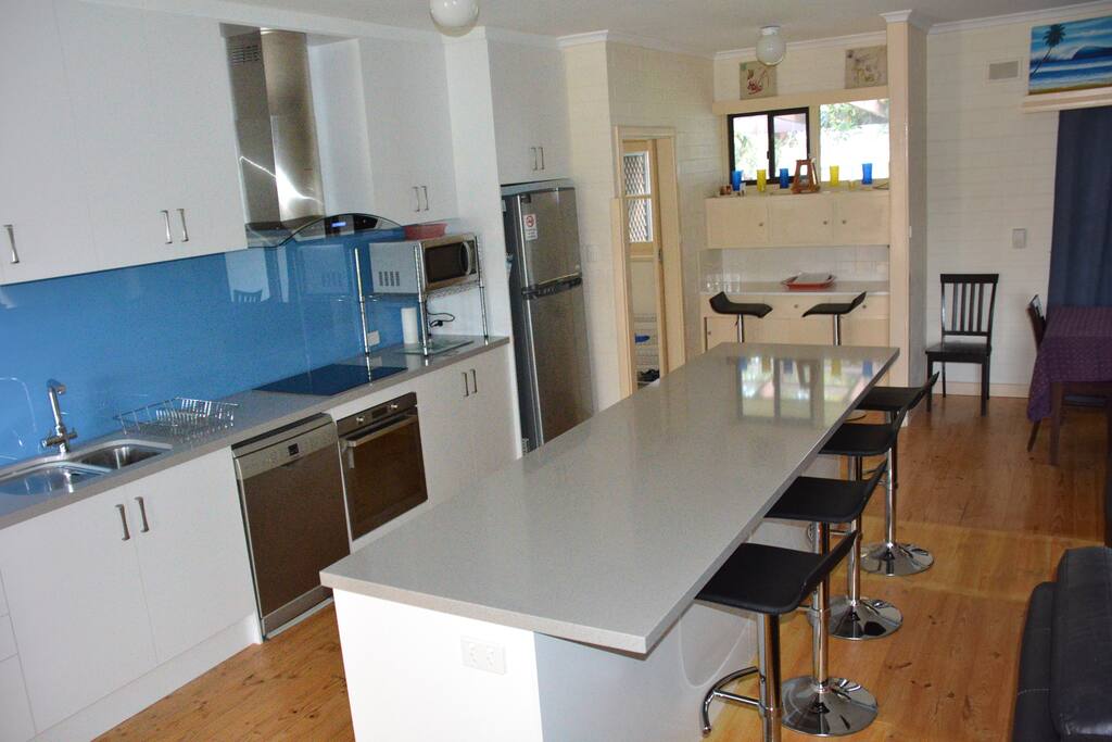 open plan kitchen with 3 m island bench overlooking lounge area