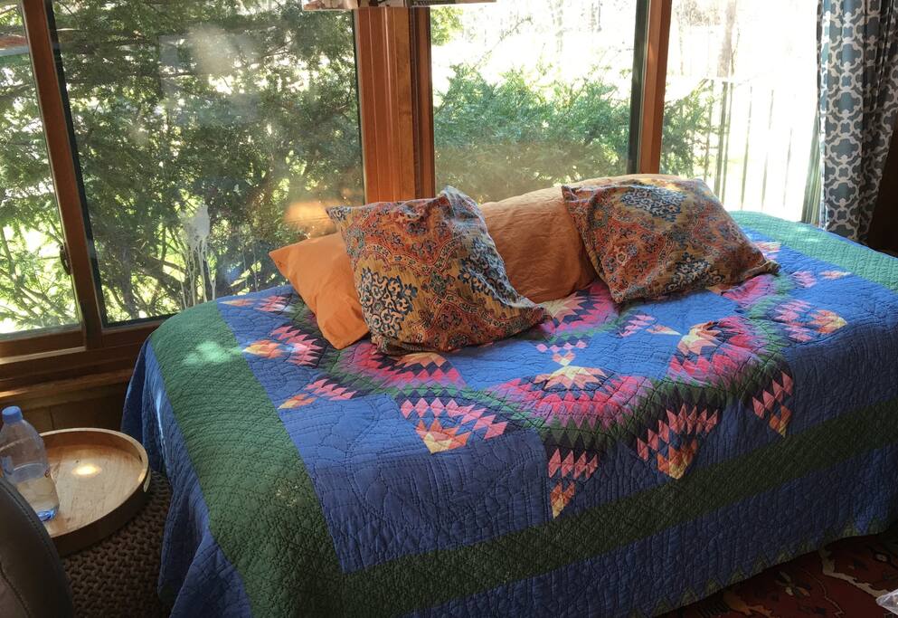 This is your sleeping area w/ the massage chair & direct access to kitchen & deck