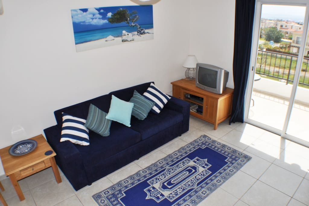 Comfortable living area with TV, DVD and sea views