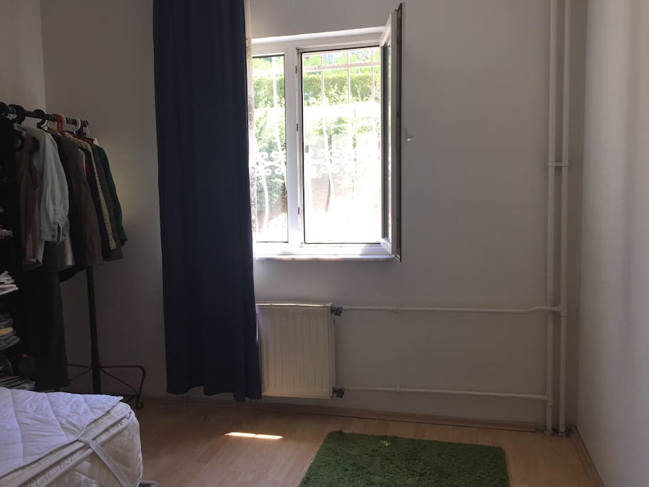 The rented room has double bed and open wardrobe.
