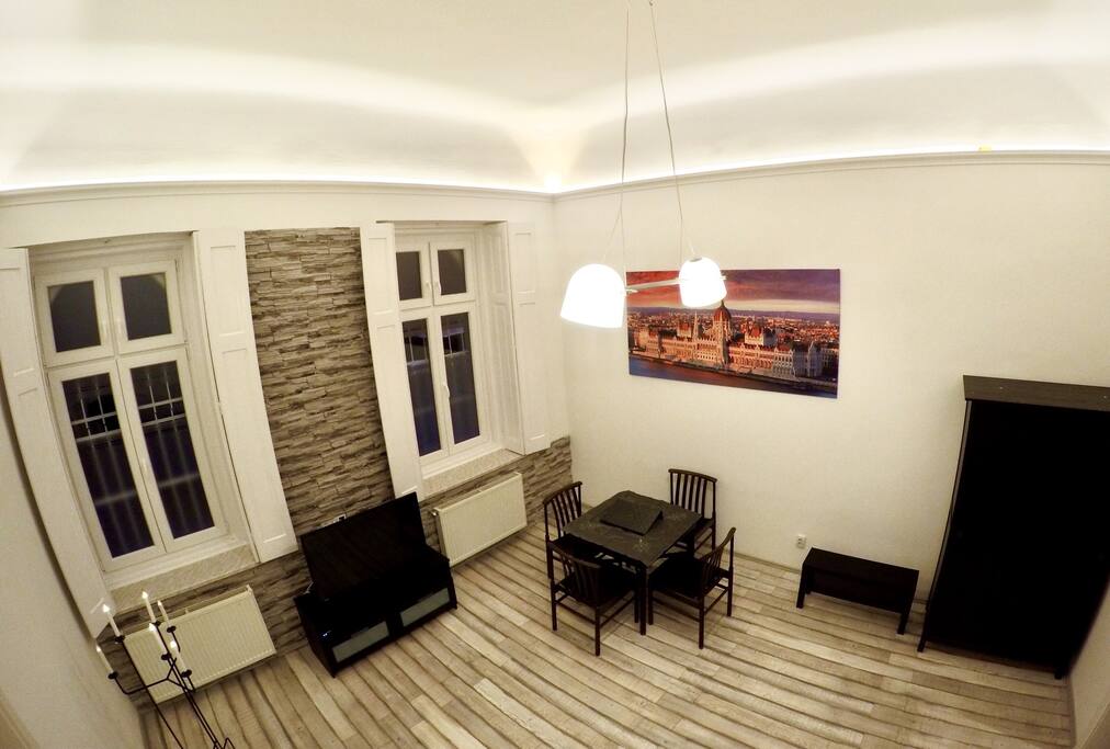 Modern flat in the old house: 5m inner height, with warm LED light.