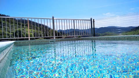 house with a pool and a hot tub