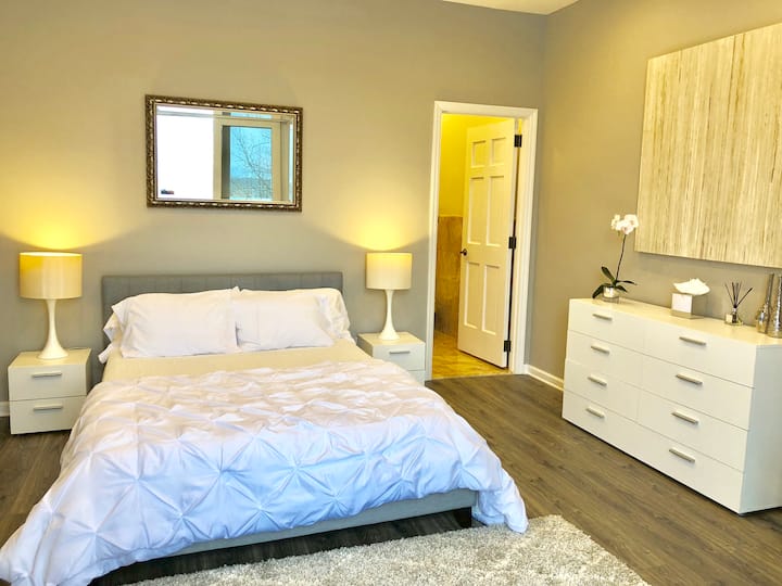 Queen Bed w half bath en suite. PLEASE NOTE- This bedroom is within the primary bedroom. Railroad - Room within a room, has door for privacy. Works as a bonus bedroom. 