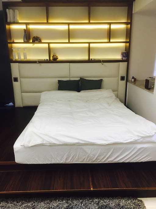 cozy queen size bed with goose feather topper