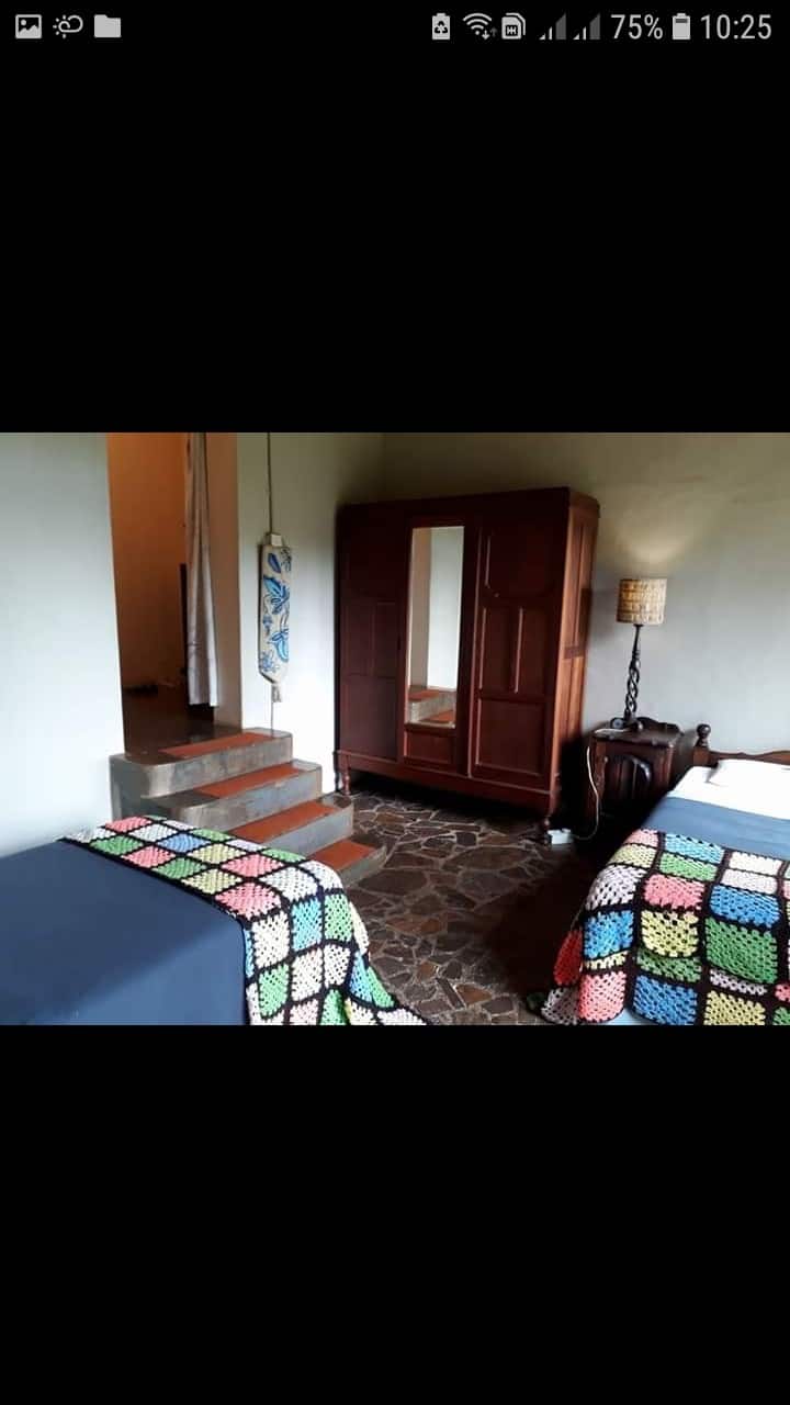 Bedroom with 2 single beds for the kids which is the passage to the second double bedroom 