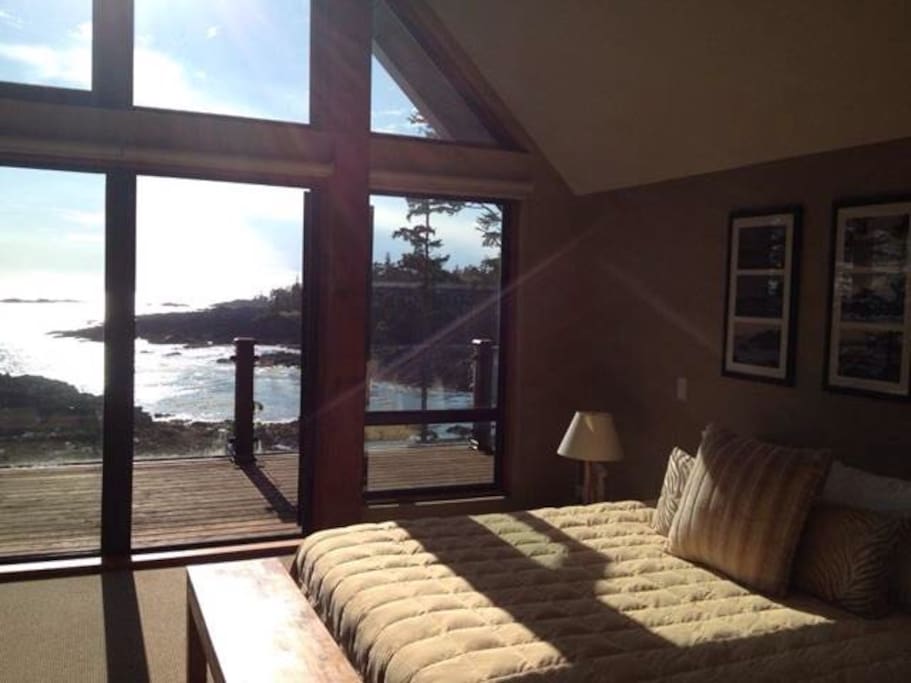 Master bedroom with upper balcony and ocean view. Can see many Eagles.