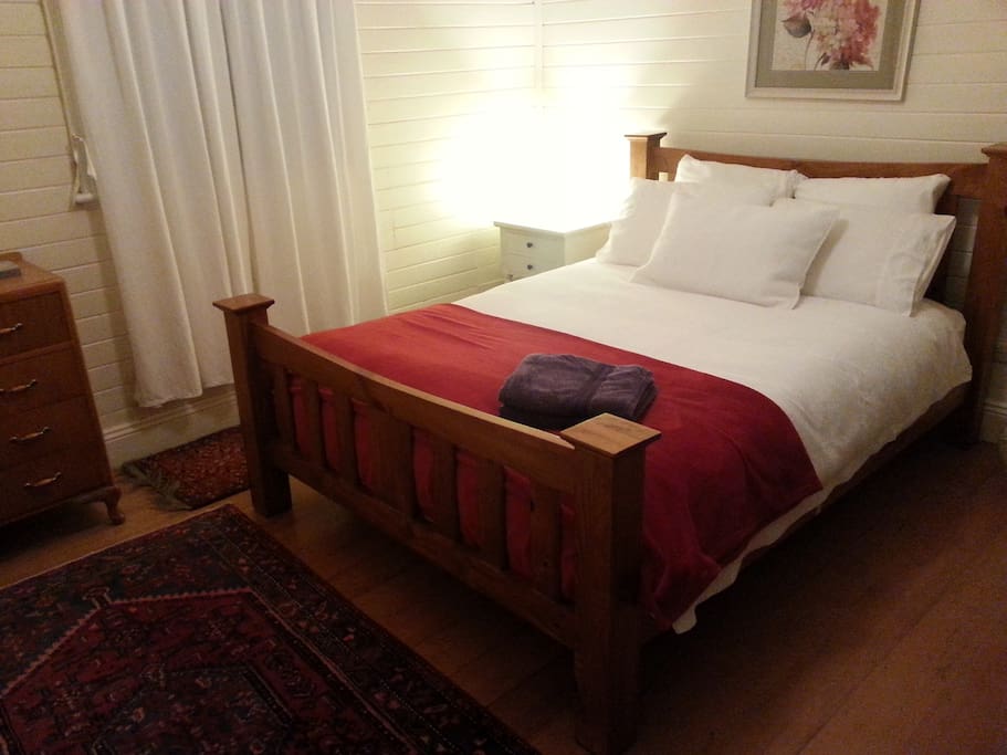 Main bedroom with comfy Queen Bed. French doors to sunny verandah.