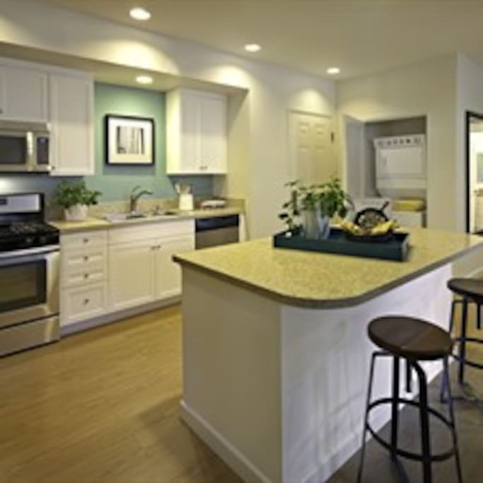 Similar floor plan to our specific unit! Large center island and hard wood floors