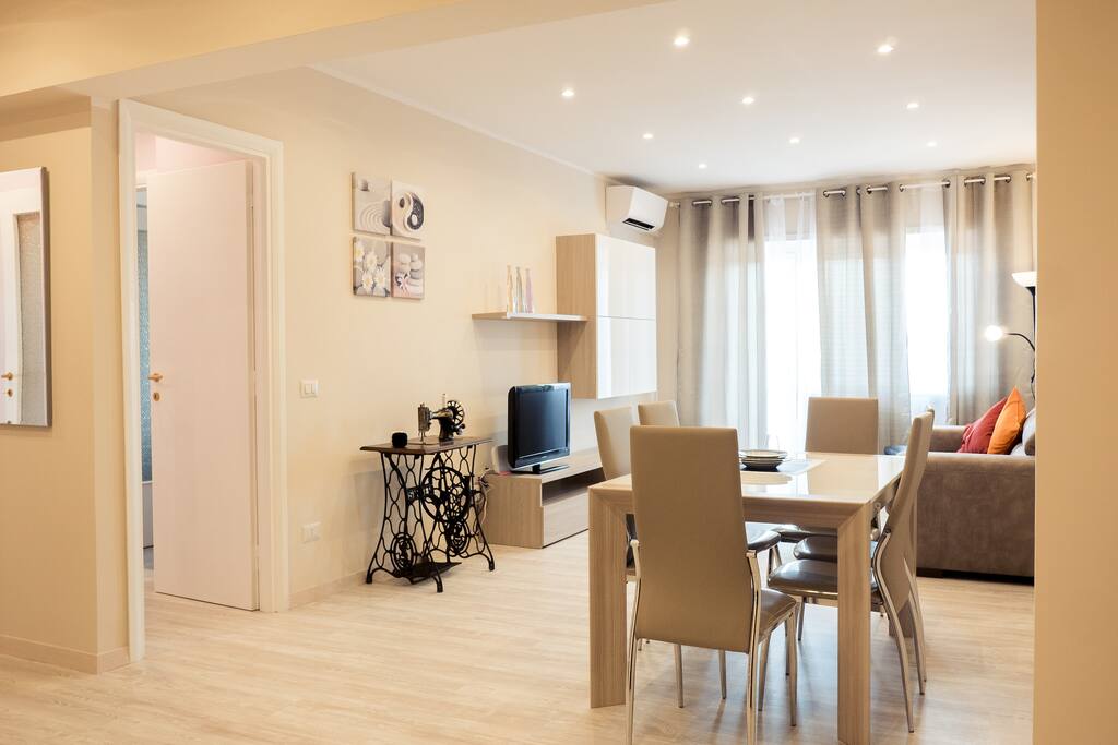 The pale-sandy living room is bright and cozy