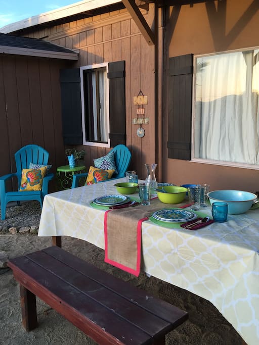 Outdoor dining table with large set of outdoor dinnerware (or breakfast-ware...)