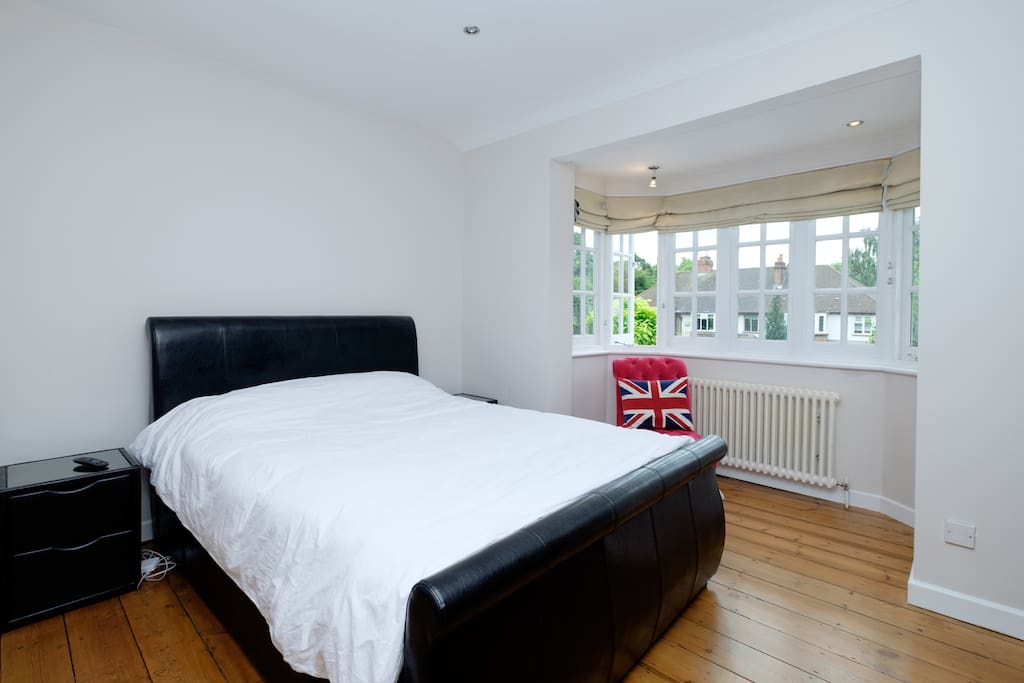 Bedroom 1: A spacious room with a king size bed and TV