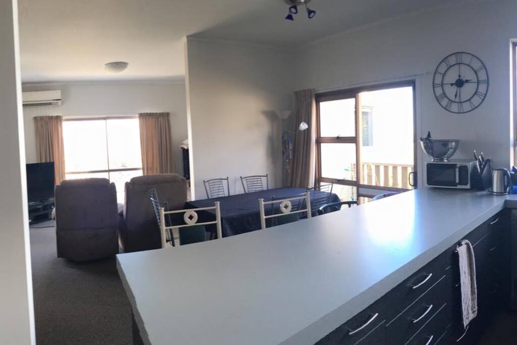 A spacefull kitchen/lounge with all day direct light and a stunning view.
