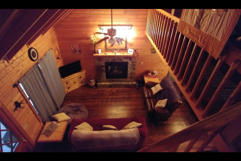 Living room with two couches and a bean bag chair that pulls out into a single bed.