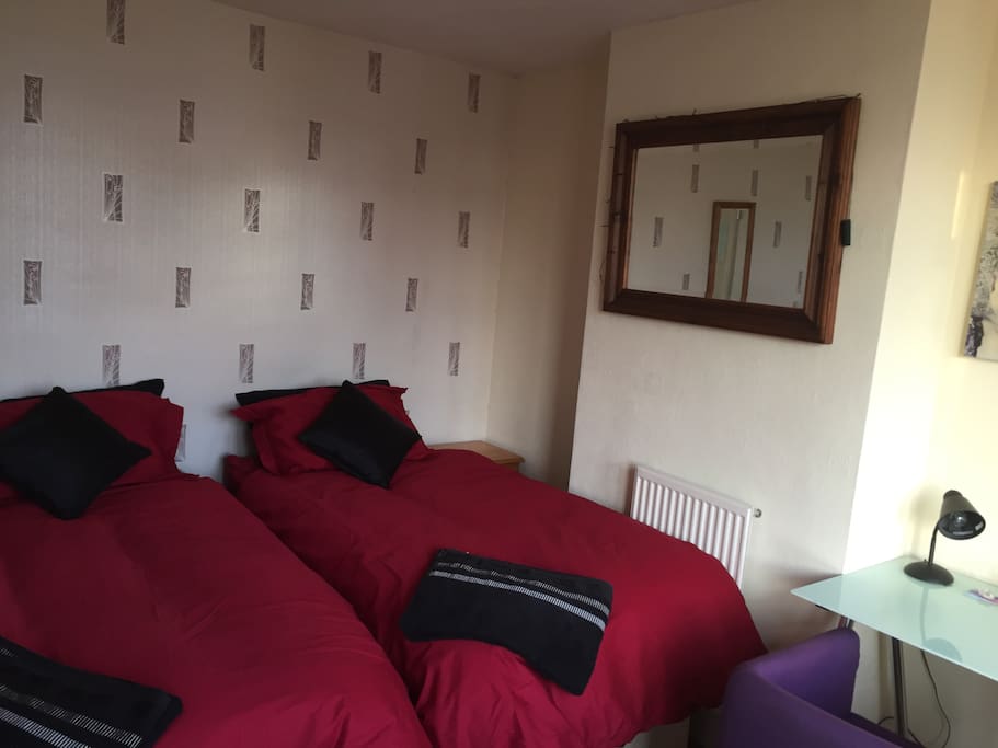 Comfortable twin / Kingsize bedroom. This is a large room where the two single beds can be brought together to make one large king size bed if necessary.