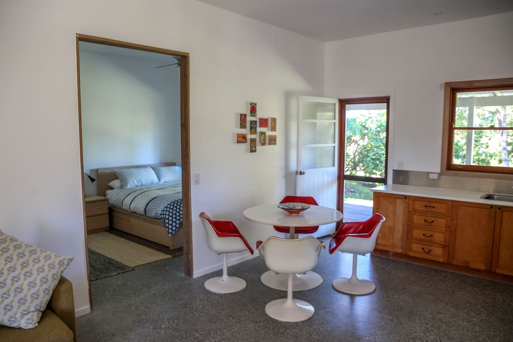 open plan living with a bedroom glimpse
