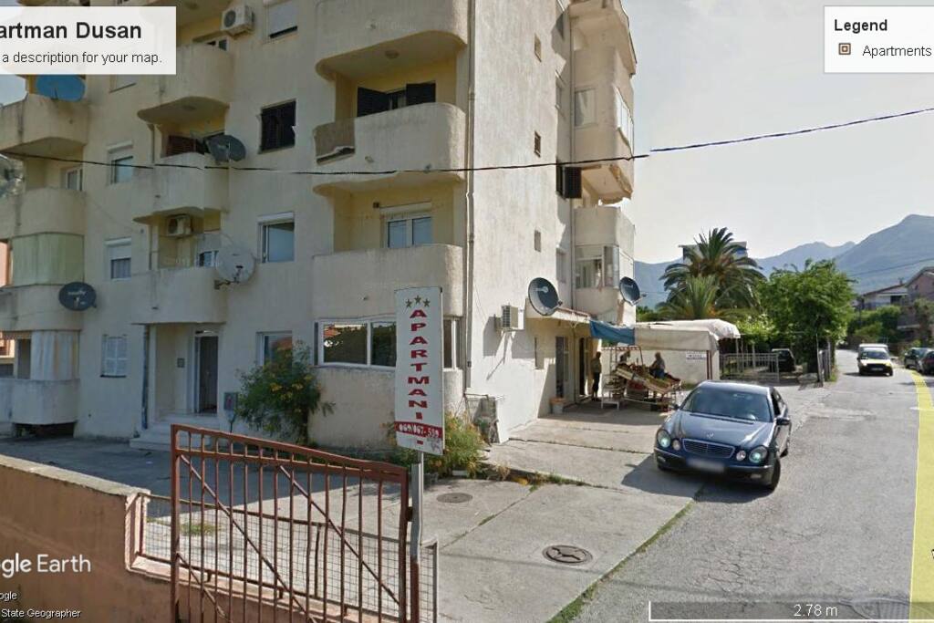 1st floor corner with white satellite dish