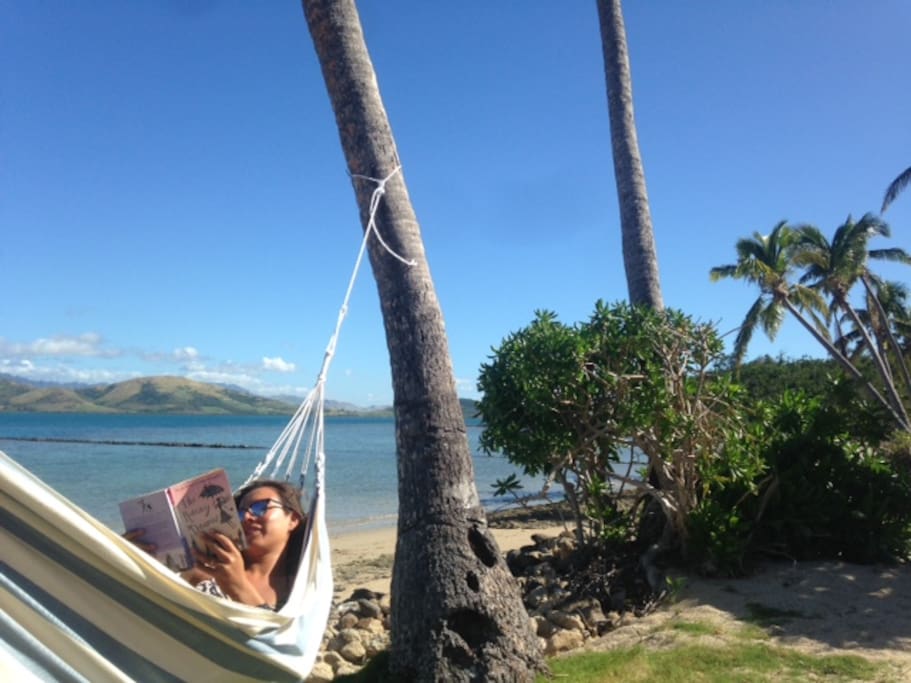 Relax reading your book in one of 5 hammocks on the beach!