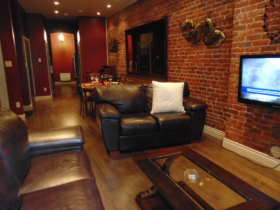 Spacious Apartment with Exposed Interior Brick Walls.