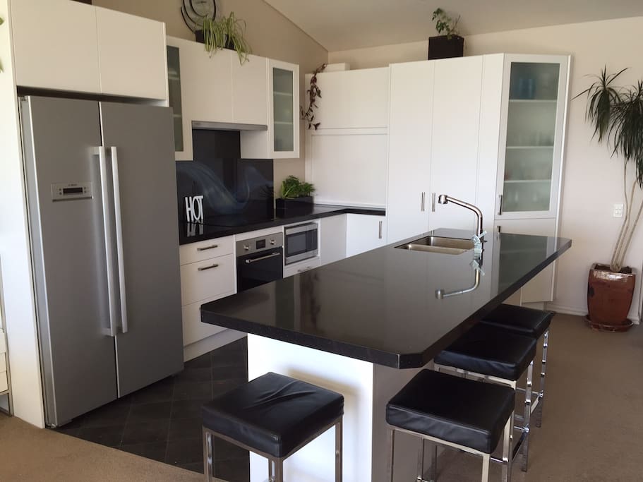 A large and spacious kitchen, great for sitting at and having a wine!