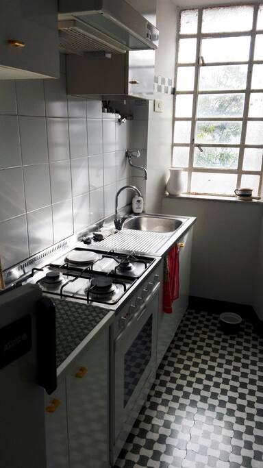 A small but sunny and functional kitchen.