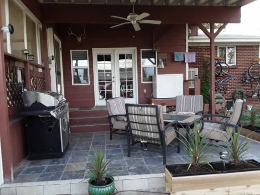 Back yard patio w/ bar-be-cue and fire pit.