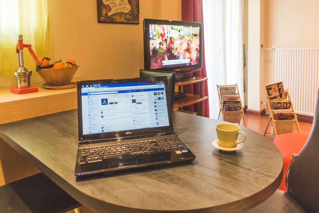 Big table in living room. You can have your coffee here doing things on the free wifi internet.