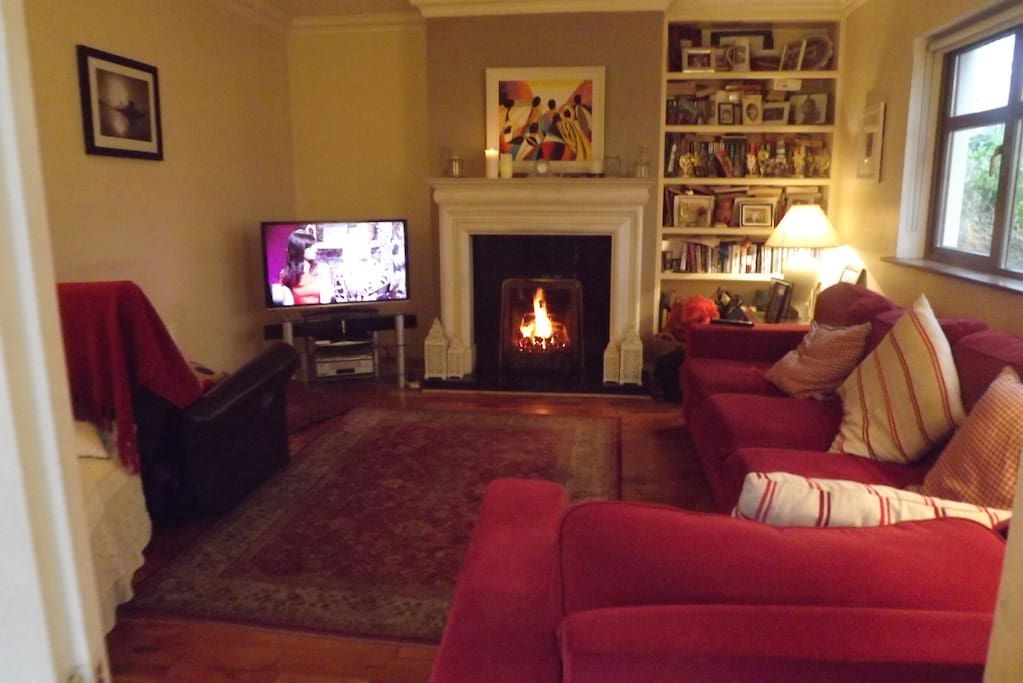 Sitting Room with TV and open fire off kitchen area