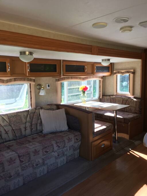 Couch and table open to two double beds