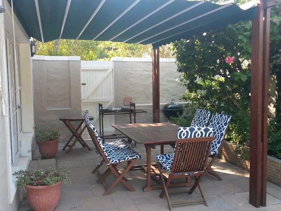 One of two patio's, this one has a roll out awning, the other is a covered pergola.