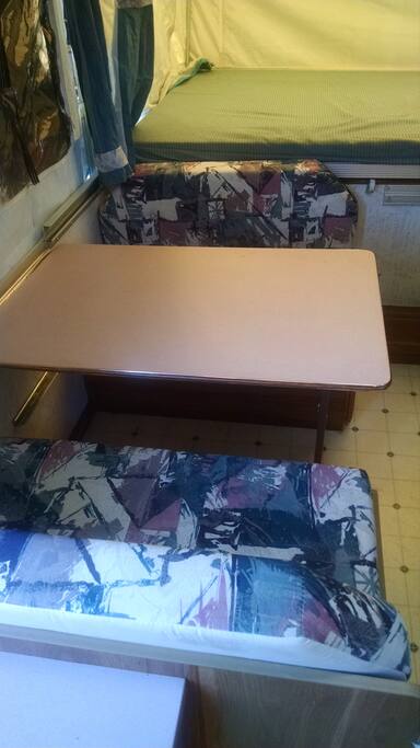 Table for eating and single bed option.