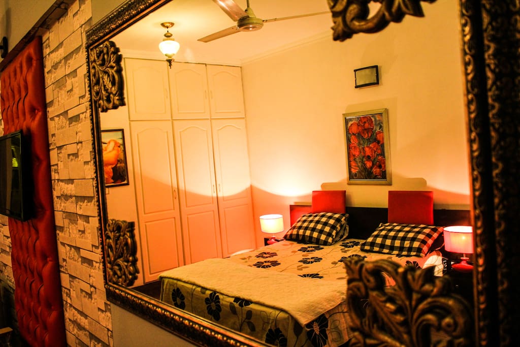 Reflection Of King Size Bed Through Dressing Console Mirror