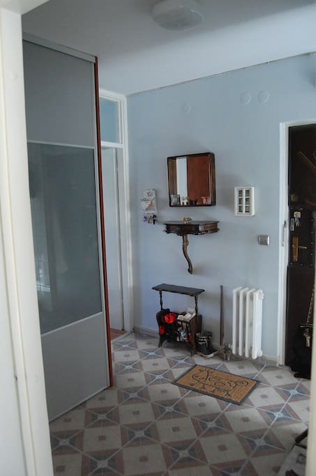 The room is in the hallway, next to the entrance door, so has privacy.