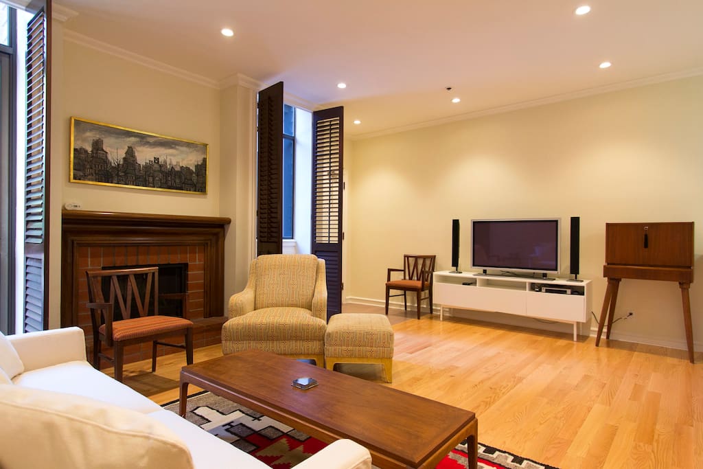 Entrance is to the left of the television and chair. Please leave your shoes at the door. We keep the floors pristine. We do not wear our outdoor shoes inside the condo.