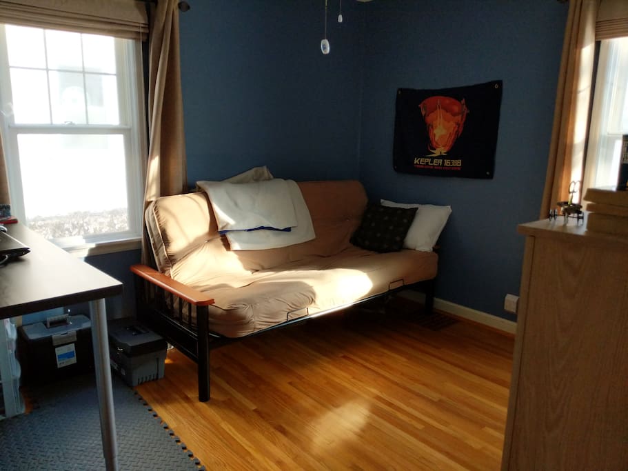 Bedroom with futon and desk